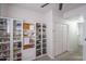 Bedroom featuring carpeted floor, closet with sliding doors, and custom shelving for shoes and other storage at 18250 N Cave Creek Rd # 164, Phoenix, AZ 85032