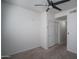 A simple bedroom with neutral paint, carpet and a ceiling fan at 18250 N Cave Creek Rd # 164, Phoenix, AZ 85032