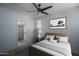 Staged bedroom with ceiling fan, walk-in closet, neutral color palette, carpeted floors at 18250 N Cave Creek Rd # 164, Phoenix, AZ 85032