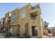 View of multi-story townhome with brick facade and private entrance at 18250 N Cave Creek Rd # 164, Phoenix, AZ 85032