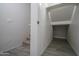 This is a view of the hallway which leads to a carpeted staircase at 18250 N Cave Creek Rd # 164, Phoenix, AZ 85032