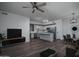 Open concept kitchen leading to living area with stainless appliances and hardwood flooring at 18250 N Cave Creek Rd # 164, Phoenix, AZ 85032