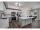 Stylish kitchen featuring stainless appliances, white cabinets, and an island perfect for entertaining at 18250 N Cave Creek Rd # 164, Phoenix, AZ 85032