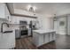 Modern kitchen with stainless steel appliances, a large island, and elegant white cabinets at 18250 N Cave Creek Rd # 164, Phoenix, AZ 85032