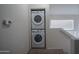Stacked washer and dryer laundry closet with easy access, set near stairs at 18250 N Cave Creek Rd # 164, Phoenix, AZ 85032