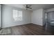 Bright living room with wood floors, a ceiling fan, and ample natural light at 18250 N Cave Creek Rd # 164, Phoenix, AZ 85032