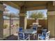 Community area featuring a grill, lighting instructions, trash can, and a table with chairs at 18250 N Cave Creek Rd # 164, Phoenix, AZ 85032