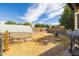 View of the expansive backyard area with a chicken coop and low block wall at 18435 N 36Th Ave, Glendale, AZ 85308