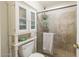 Shower boasts updated tile, glass doors and built-in storage at 18435 N 36Th Ave, Glendale, AZ 85308