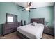 Bedroom with a soothing color palette, ceiling fan, and modern furnishings at 18435 N 36Th Ave, Glendale, AZ 85308