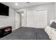 This bedroom includes a large closet, ceiling fan and hardwood floors at 1847 W Isleta Ave, Mesa, AZ 85202