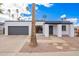 Contemporary home featuring a white exterior, gray accents, desert landscaping and attached garage at 1847 W Isleta Ave, Mesa, AZ 85202