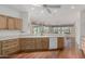 Well-lit kitchen featuring oak cabinets, white countertops, and an open layout at 20029 N Coronado Ridge Dr, Surprise, AZ 85387