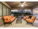 Cozy covered patio with comfortable orange-striped seating and an outdoor ambiance at 20029 N Coronado Ridge Dr, Surprise, AZ 85387