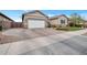 Charming single-Gathering home boasting a manicured lawn, brick accents, and a spacious driveway at 20102 E Robin Rd, Queen Creek, AZ 85142