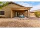 Comfortable back patio with pergola, ideal for outdoor dining and relaxation at 213 S 225Th Ln, Buckeye, AZ 85326