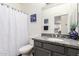 Bathroom featuring granite vanity and shower at 213 S 225Th Ln, Buckeye, AZ 85326