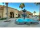 Clubhouse entrance featuring a fountain and manicured landscaping at 213 S 225Th Ln, Buckeye, AZ 85326