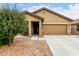 Charming single-story home featuring a low-maintenance front yard and attached two-car garage at 213 S 225Th Ln, Buckeye, AZ 85326