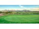 Expansive golf course view showcasing lush green fairways and mountain backdrop at 213 S 225Th Ln, Buckeye, AZ 85326