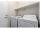 Practical laundry room with modern washer and dryer at 213 S 225Th Ln, Buckeye, AZ 85326