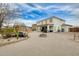 Expansive backyard featuring a covered patio, outdoor seating, and a charming fire pit, ideal for entertaining at 23693 W La Vista Cir, Buckeye, AZ 85396