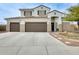 Stunning two-story home featuring a three-car garage and professionally landscaped front yard at 23693 W La Vista Cir, Buckeye, AZ 85396