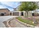 Beautiful home with a three-car garage, complemented by a well-maintained lawn and attractive landscaping at 23693 W La Vista Cir, Buckeye, AZ 85396