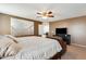 Spacious main bedroom featuring an entertainment center, neutral color palette, and soft lighting at 23693 W La Vista Cir, Buckeye, AZ 85396