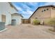 Side yard with a secure gate, providing privacy and separation between properties at 23693 W La Vista Cir, Buckeye, AZ 85396