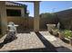 Back patio featuring brick flooring, patio seating, planters, and decor accents in a backyard retreat at 24986 N 172Nd Ln, Surprise, AZ 85387