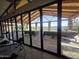 Community gym featuring glass doors opening to patio with lake view offering tranquil workout experience at 24986 N 172Nd Ln, Surprise, AZ 85387