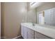 Bright bathroom with a single sink vanity and a large mirror at 2600 E Springfield Pl # 59, Chandler, AZ 85286