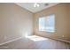 A bedroom with a neutral paint palette and a window with blinds at 2600 E Springfield Pl # 59, Chandler, AZ 85286