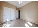 This bedroom features a ceiling fan and closet with sliding doors at 2600 E Springfield Pl # 59, Chandler, AZ 85286