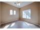 Bright bedroom with arched windows and neutral colored walls at 2600 E Springfield Pl # 59, Chandler, AZ 85286