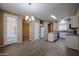 Open kitchen with white cabinets, island, and stainless steel appliances at 2600 E Springfield Pl # 59, Chandler, AZ 85286