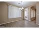 Living room with neutral walls, hardwood style floors, a modern chandelier, and natural light at 2600 E Springfield Pl # 59, Chandler, AZ 85286