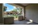 Private covered patio with views of landscaped community grounds and a gated entrance at 2600 E Springfield Pl # 59, Chandler, AZ 85286