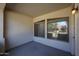 Cozy covered patio featuring warm exterior lighting and views of the neighborhood at 2600 E Springfield Pl # 59, Chandler, AZ 85286