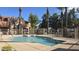 Community pool surrounded by palm trees, offering residents a refreshing retreat at 2600 E Springfield Pl # 59, Chandler, AZ 85286