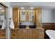 Bathroom featuring double sinks and custom cabinetry at 3060 W Ironwood Cir, Chandler, AZ 85226