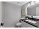 Bathroom featuring vanity with black countertop at 3060 W Ironwood Cir, Chandler, AZ 85226