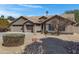 Charming single-story home features a three-car garage, neutral stucco, and low-maintenance desert landscaping at 3060 W Ironwood Cir, Chandler, AZ 85226