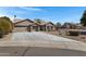 Lovely single-story home featuring a three-car garage, neutral stucco, and desert landscaping at 3060 W Ironwood Cir, Chandler, AZ 85226