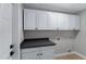 Laundry room with cabinets and black countertop at 3060 W Ironwood Cir, Chandler, AZ 85226