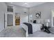 Spacious main bedroom features neutral tones, carpet, and ceiling fan at 3060 W Ironwood Cir, Chandler, AZ 85226