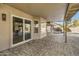 Covered patio area with brick pavers, perfect for outdoor dining and relaxation at 3060 W Ironwood Cir, Chandler, AZ 85226