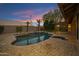 Stunning backyard pool and patio with evening sky, perfect for relaxing and entertaining at 3060 W Ironwood Cir, Chandler, AZ 85226