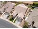 Aerial shot of the property featuring a well-maintained tile roof and landscaped yards in the neighborhood at 3121 N Loma Vista Dr, Mesa, AZ 85213